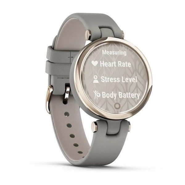 Garmin Lily Classic smartwatch with a cream-gold bezel, gray case, and Italian leather strap