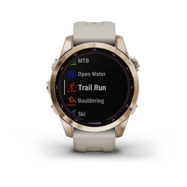 Garmin Fenix ​​7S Sapphire Solar Smartwatch in Gold Titanium with a Light Beige Strap