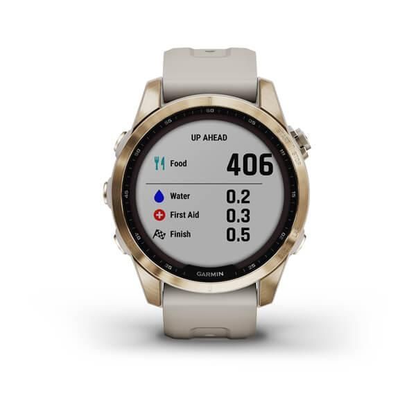 Garmin Fenix ​​7S Sapphire Solar Smartwatch in Gold Titanium with a Light Beige Strap